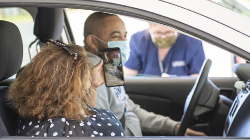 Couple getting vaccinated in drive-thru clinic