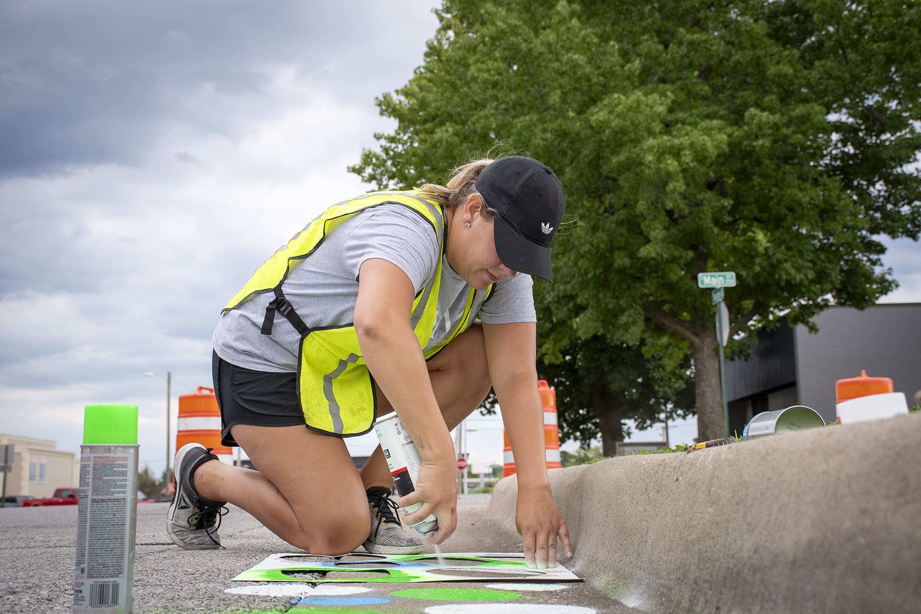 Woman painting crosswalk